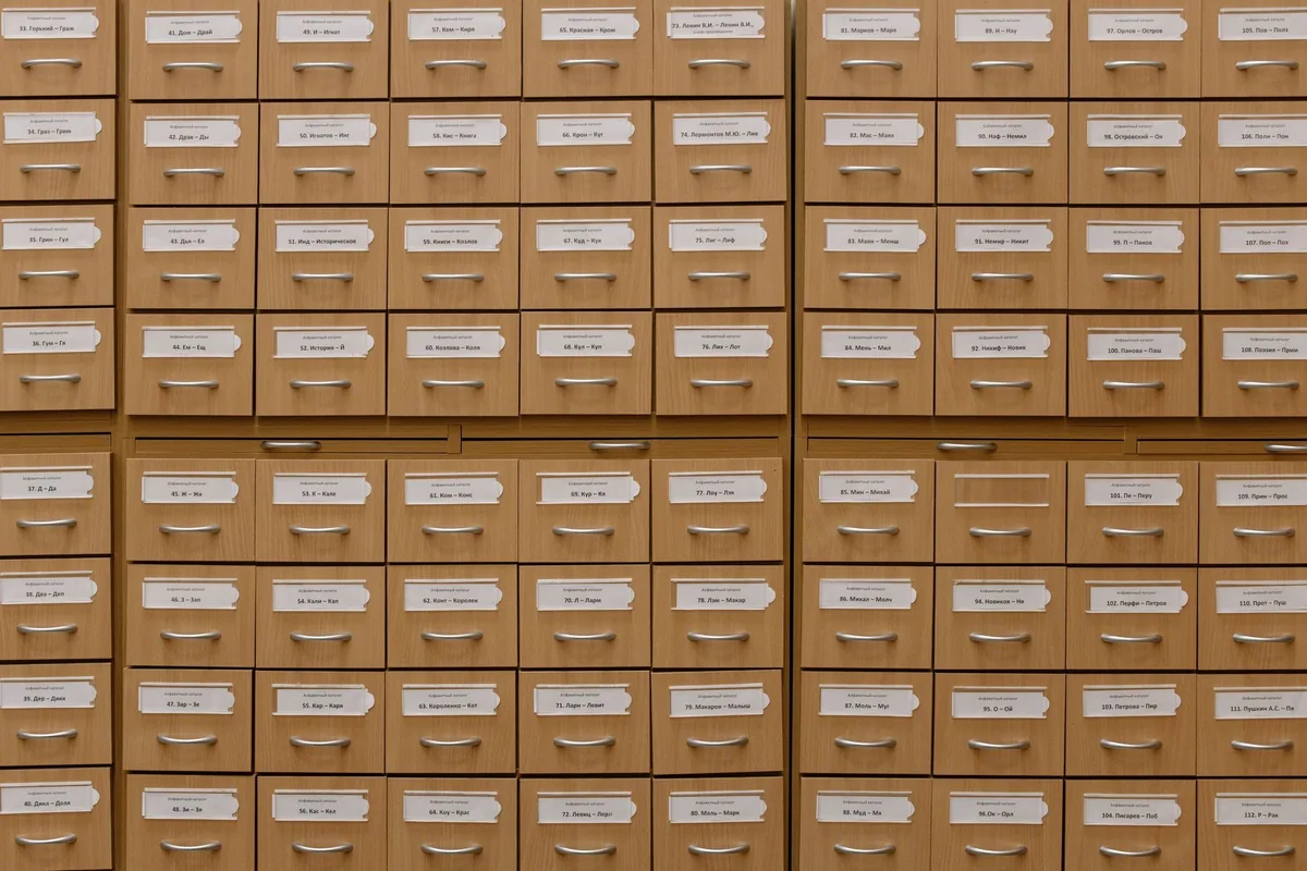 Close-up of labeled wooden storage drawers, perfect for organization concepts.