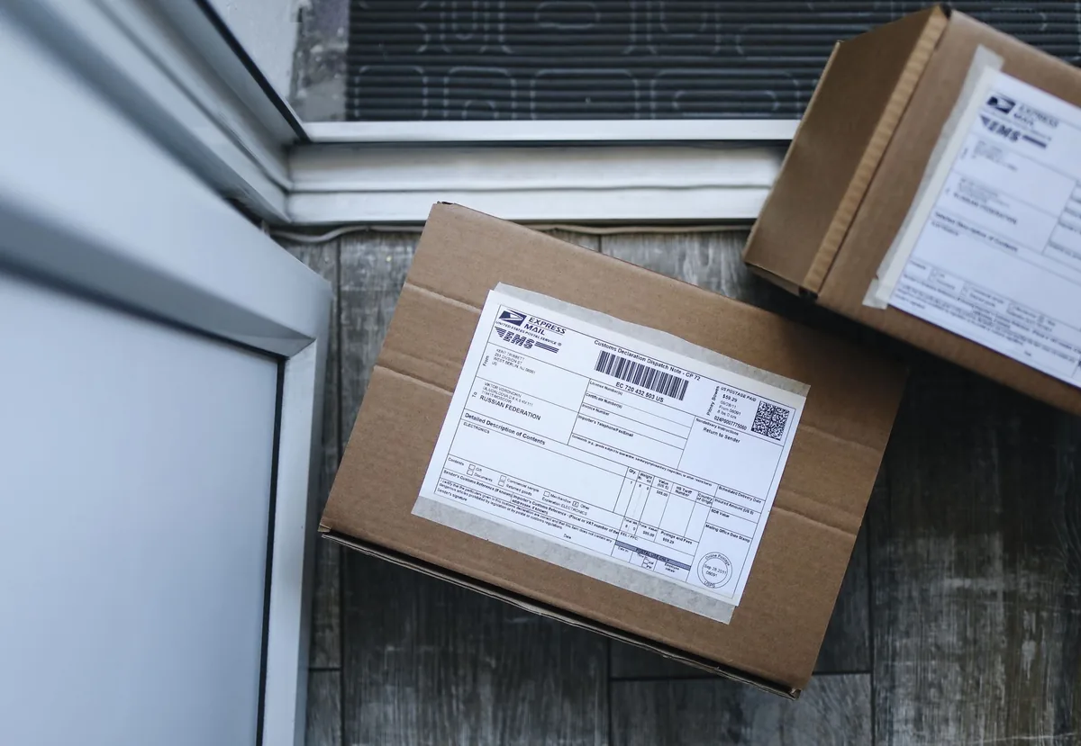 Close-up of a package delivery box on a doorstep, highlighting logistics concepts.
