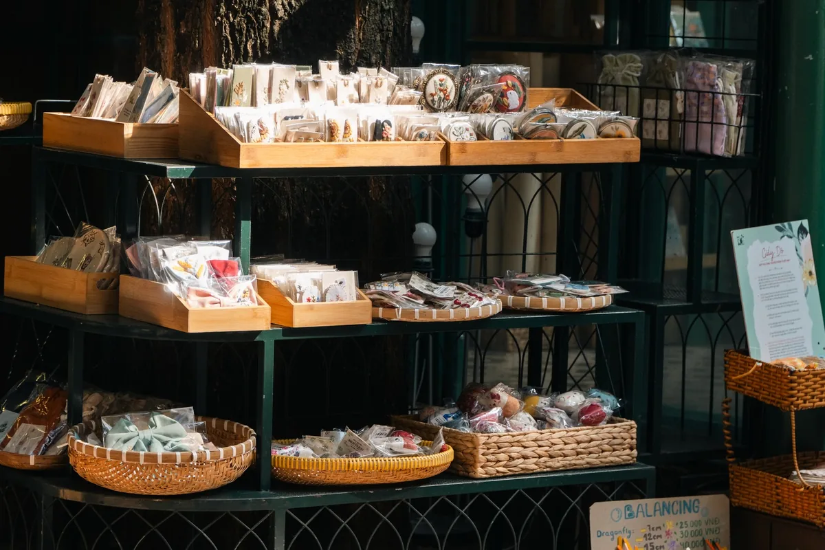 Explore handcrafted goods displayed outdoors at a cozy market stall.