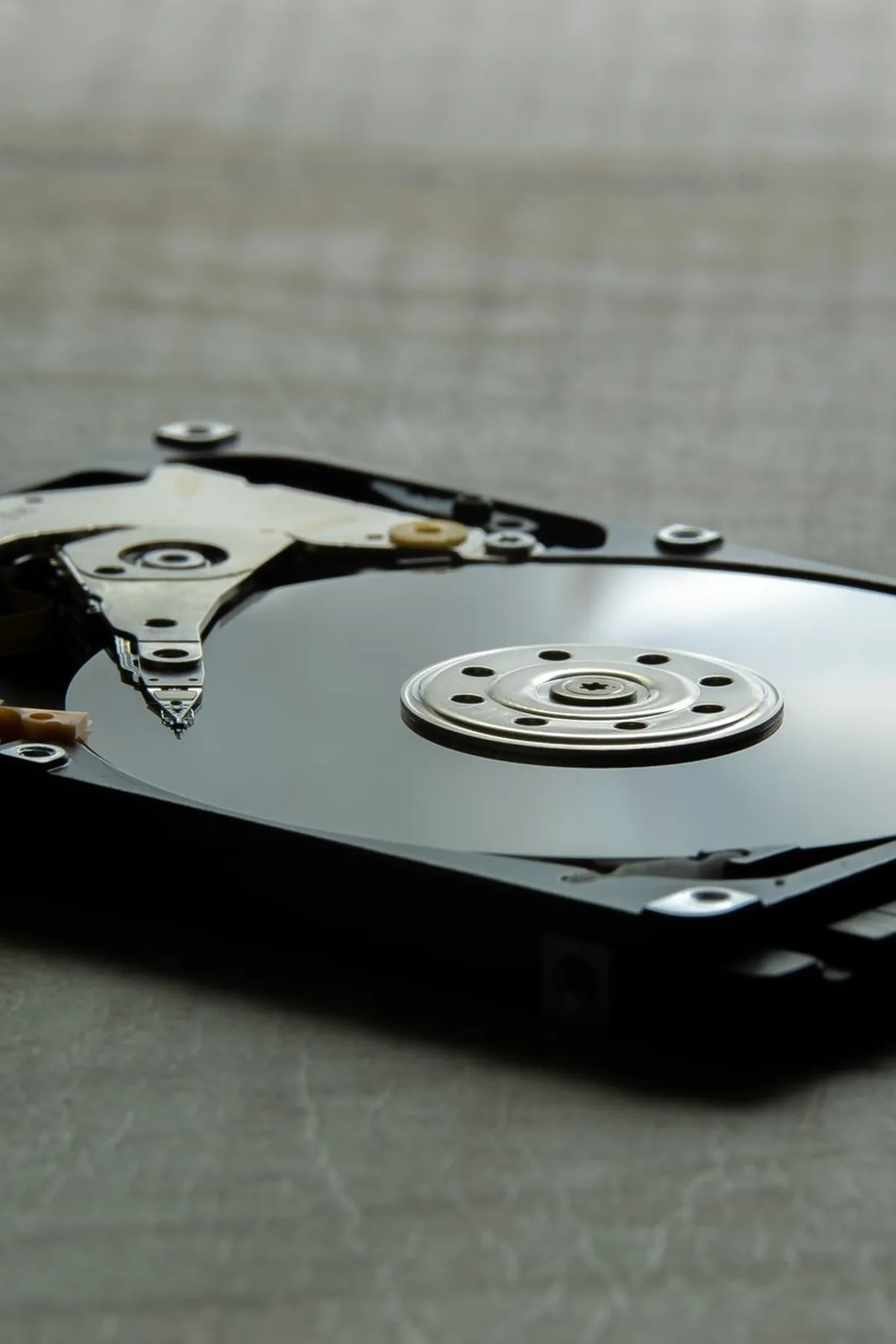Detailed view of an open hard disk drive showing its internal components.